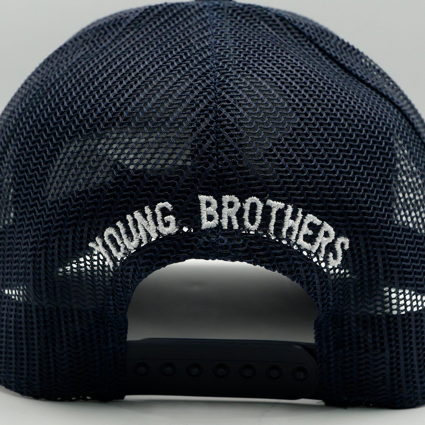 Black cap with 'YOUNG BROTHERS' text on a gray background