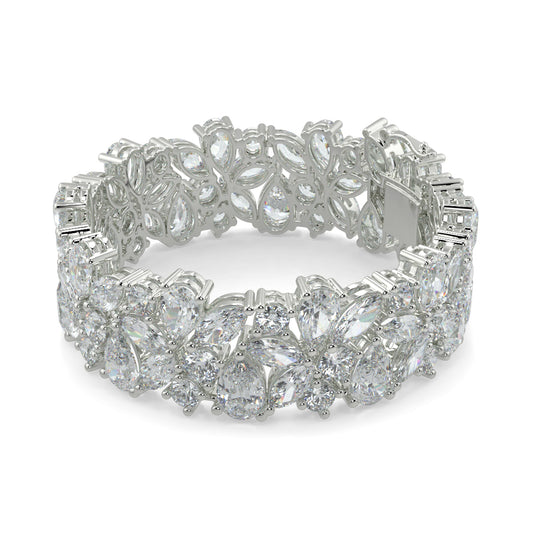 Silver bracelet with floral design on a white background  yb jewellers designer bracelet with fancy diamonds and set in platinum 18k white gold 