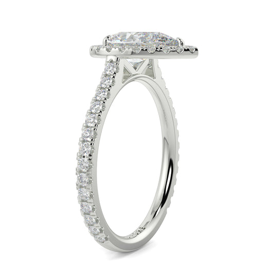 Diamond ring with a halo and smaller diamonds on a white background yb jewellers Pear engagement ring 
