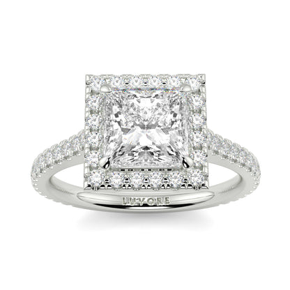 Diamond ring with a prominent central diamond and smaller diamonds on the band, on a white background. yb jewellers engagement ring princess cut diamond ring tiger claws