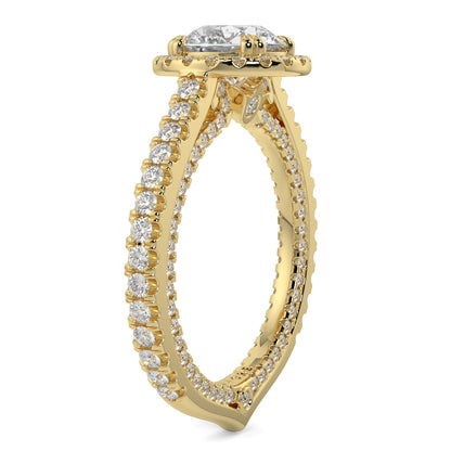 Gold ring with diamond accents on a white background round diamond halo engagement ring yb jewellers tiger claws vintage style