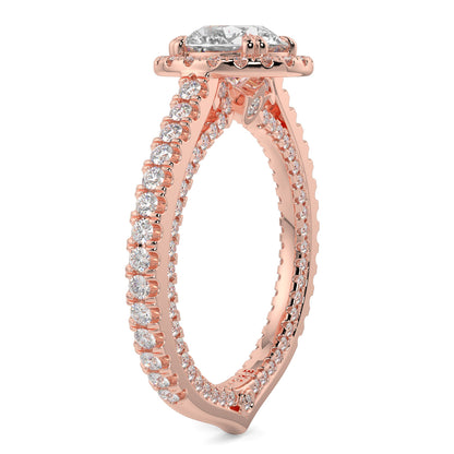 Rose gold ring with diamond accents on a white background round diamond halo engagement ring yb jewellers tiger claws vintage style