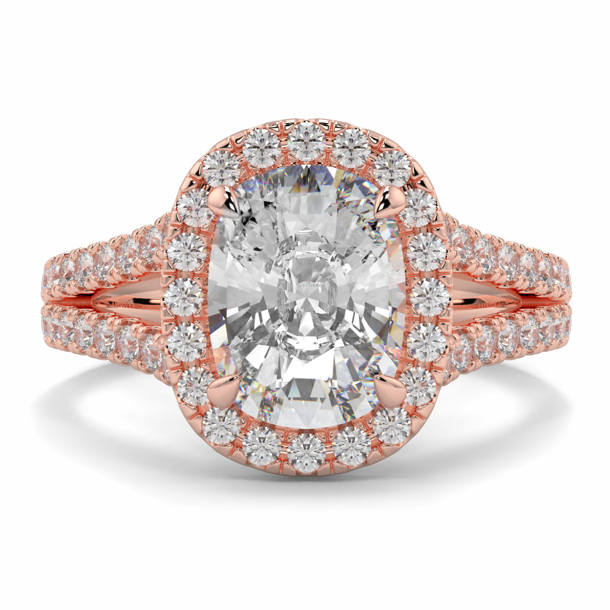 Rose gold ring with a large diamond and smaller diamonds on a white background yb jewellers split halo diamond engagement ring best selling design trending cushion cut diamond