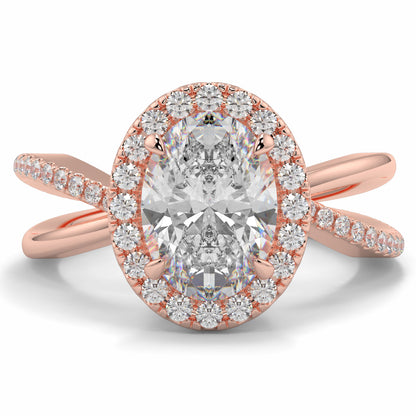 Rose gold ring with a large diamond and smaller diamonds on a white background Yb jewellers oval diamond halo platinum diamond engagement ring bestseller trending design 