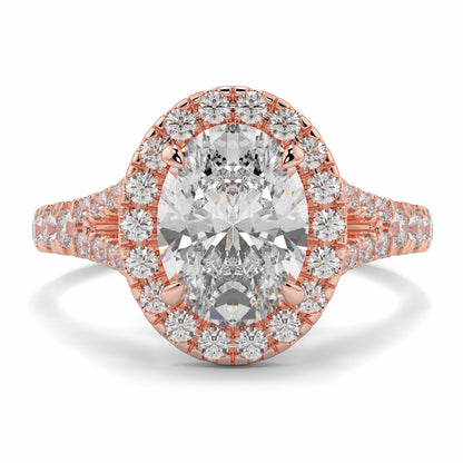 Rose gold ring with a large diamond and smaller diamonds on a white  background Yb jewellers oval diamond halo platinum diamond engagement ring bestseller trending design 