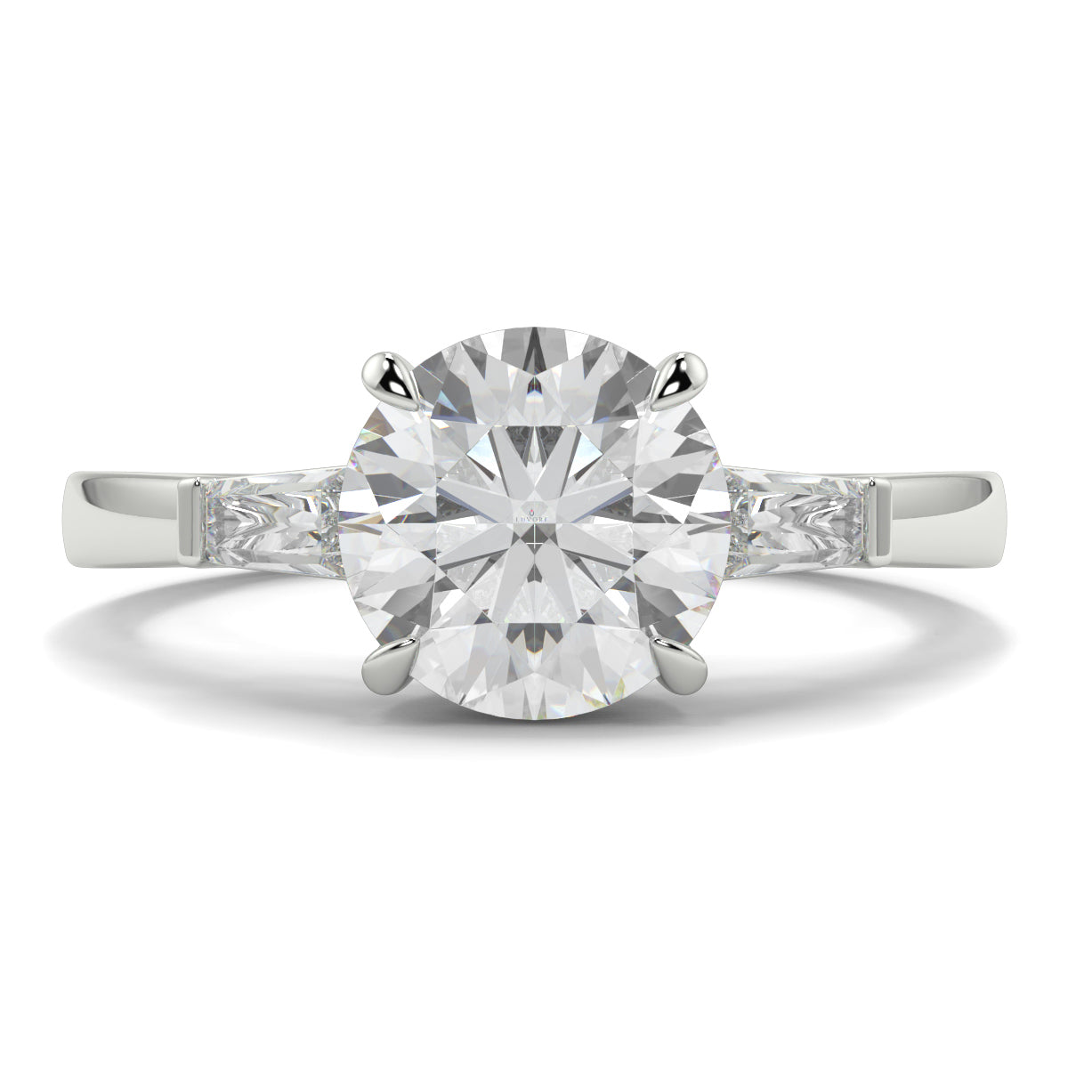 Diamond ring with a white background yb_jewellers_3_stone_trilogy_engagement_ring_round_and_pear_shape_best_selling_design_trending_diamond_ring