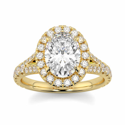 Gold ring with a large central diamond and smaller diamonds around on a white background Yb jewellers oval diamond halo platinum diamond engagement ring bestseller trending design 