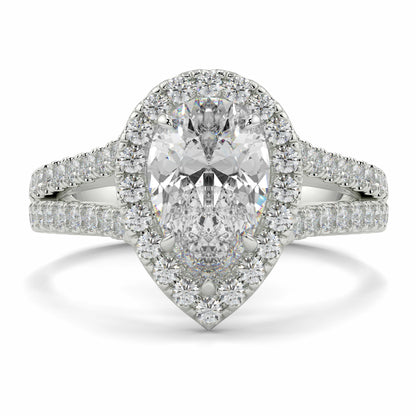 Diamond ring with a pear-shaped center stone on a white background n yb jewellers twist halo pear shape engagement diamond ring best selling design ring and trending design 2026