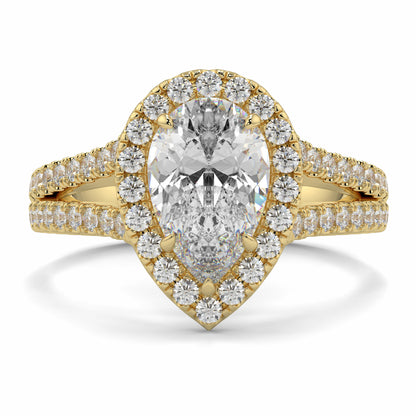Gold ring with a large central diamond and smaller diamonds around on a white background yb jewellers twist halo pear shape engagement diamond ring best selling design ring and trending design 2026
