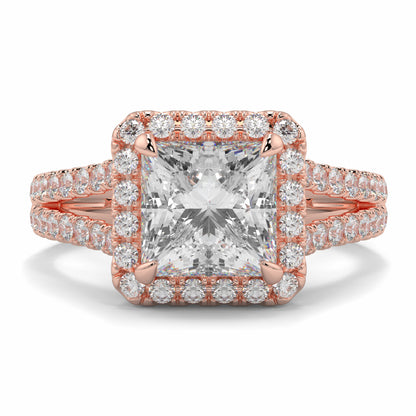 Rose gold diamond ring with a large central gemstone and smaller diamonds on a white background yb jewellers twist halo princess shape engagement diamond ring best selling design ring and trending design 2026