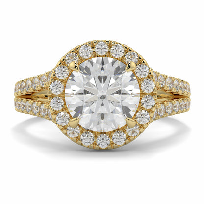 Gold ring with a large diamond and smaller diamonds around on a white background yb jewellers twist halo round shape engagement diamond ring best selling design ring and trending design 2026