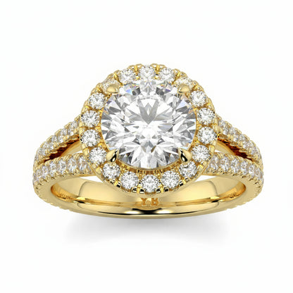 Gold ring with a large diamond and smaller diamonds around on a white background, featuring the brand  yb jewellers twist halo round shape engagement diamond ring best selling design ring and trending design 2026