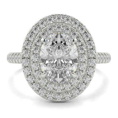 Diamond ring with a central gemstone and halo of smaller diamonds on a white background yb jewellers oval diamond engagement ring best seller trending design