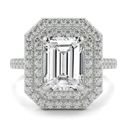 Diamond ring with emerald-cut center stone and halo on a white background yb jewellers best selling ring designs emerald diamond double halo