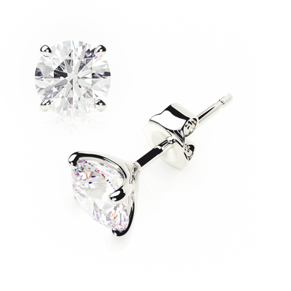 Pair of silver stud earrings with clear gemstones on a white background yb jewellers popular 4 claw diamond stud earrings for gifts