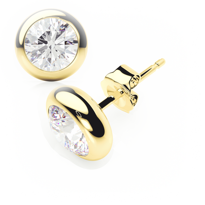 Gold earrings with clear gemstones on a white background