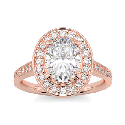 Rose gold ring with a large diamond and smaller diamonds on the band against a white background oval halo best sling design Yb Jewellers 