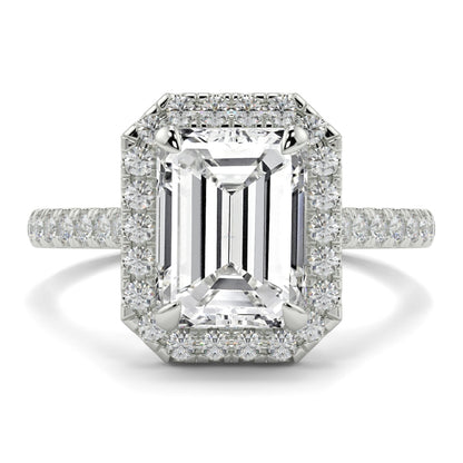 Diamond ring with emerald-cut center stone and smaller diamonds on a white background YB Jewellers Engagement Ring