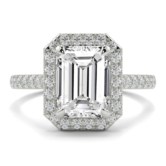 Diamond ring with emerald-cut center stone and smaller diamonds on a white background YB Jewellers Engagement Ring