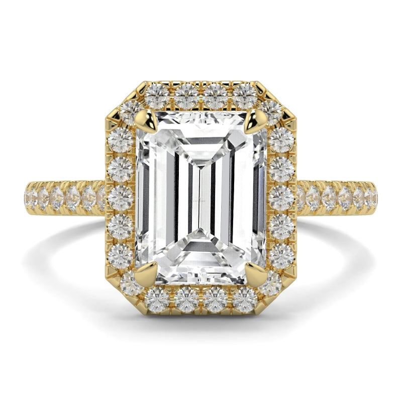 Gold ring with a large central diamond and smaller diamonds around on a white background YB_Jewellers_Engagement_Ring