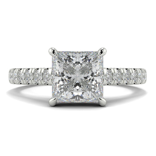 Diamond ring with a prominent central gemstone and smaller stones on the band against a white background Yb jewellers engagement ring straight band