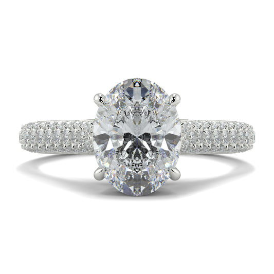 Diamond ring with two large gemstones and a smaller one on a white Yb jewellers engagement ring straight band background