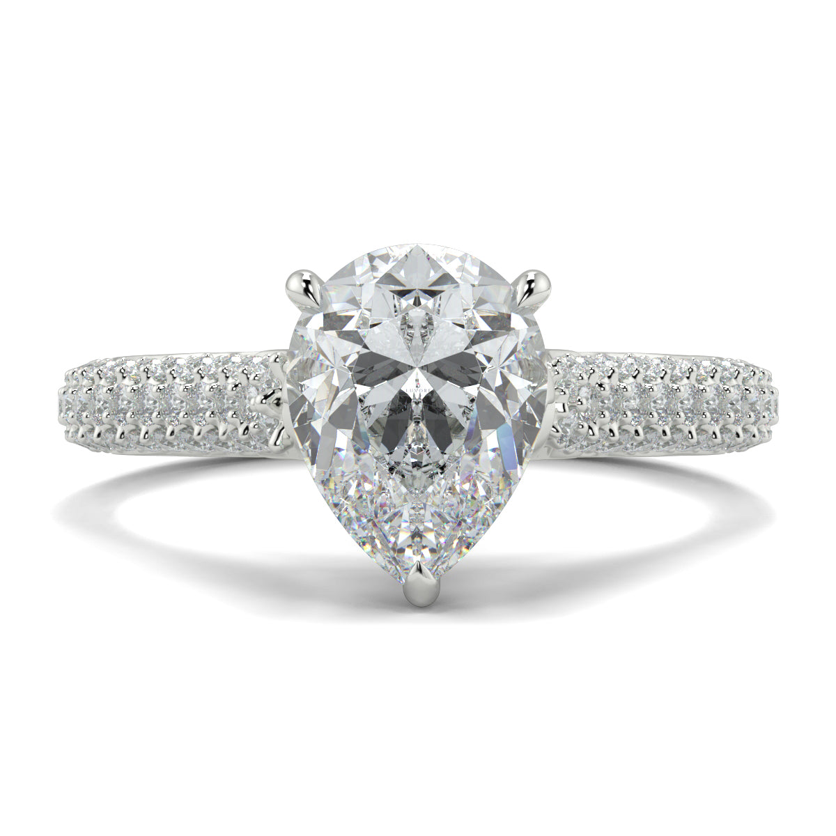 Diamond ring with a pear-shaped center stone on a white background Yb jewellers engagement ring straight band