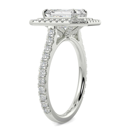 Diamond ring with a rectangular center stone on a white background yb jewellers best selling ring designs emerald diamond double halo