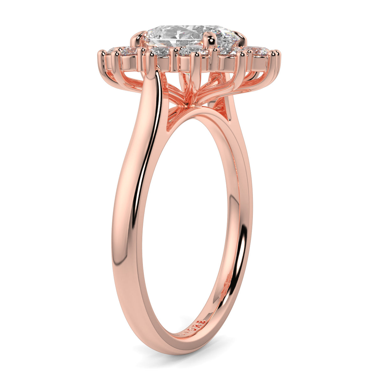 Rose gold ring with a diamond on a white background Yb jewellers engagement ring with a cluster halo and oval diamond trending design 