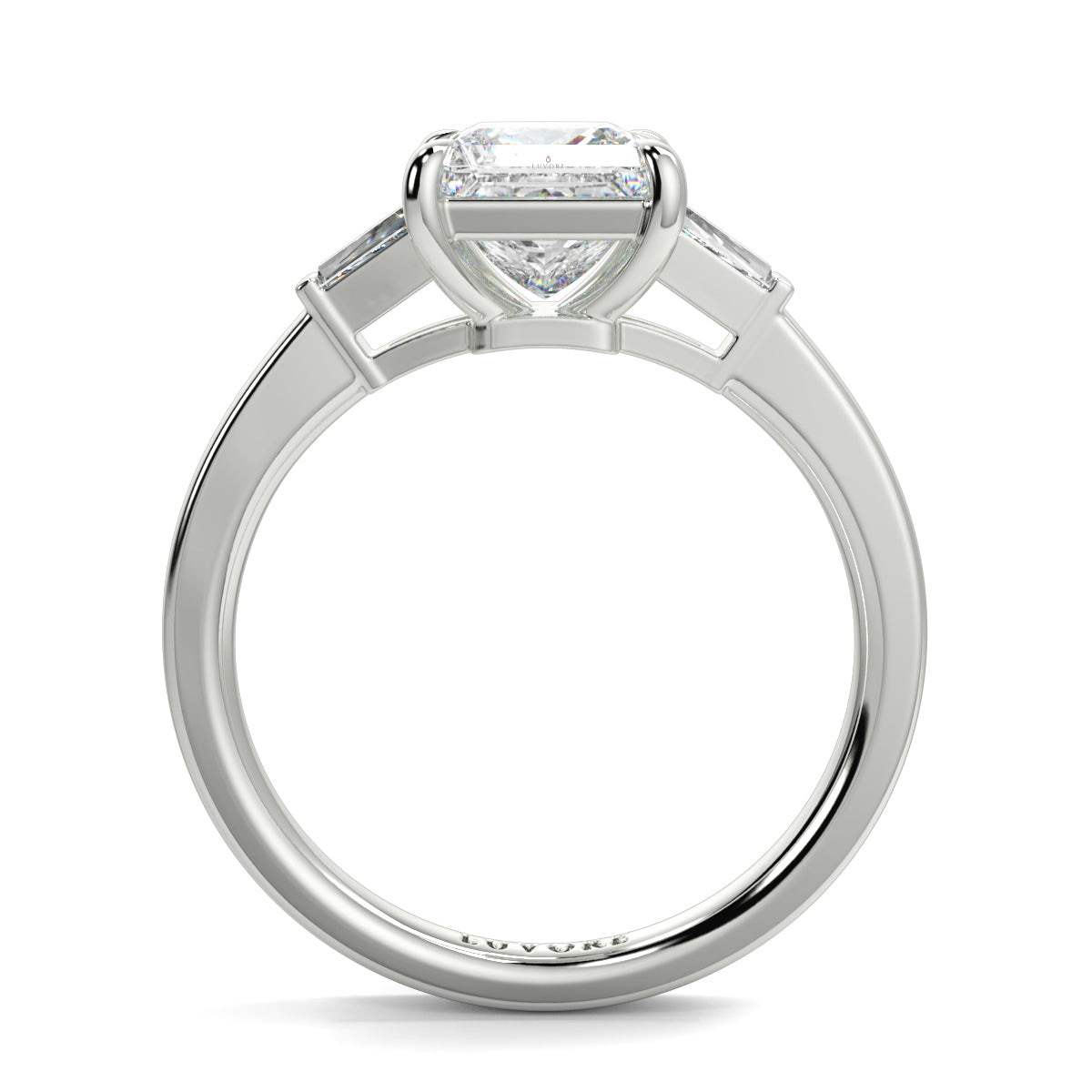Diamond ring with a heart-shaped center stone on a white background yb_jewellers_3_stone_trilogy_engagement_ring_round_and_pear_shape_best_selling_design_trending_diamond_ring