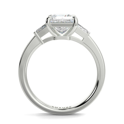 Diamond ring with a heart-shaped center stone on a white background yb_jewellers_3_stone_trilogy_engagement_ring_round_and_pear_shape_best_selling_design_trending_diamond_ring
