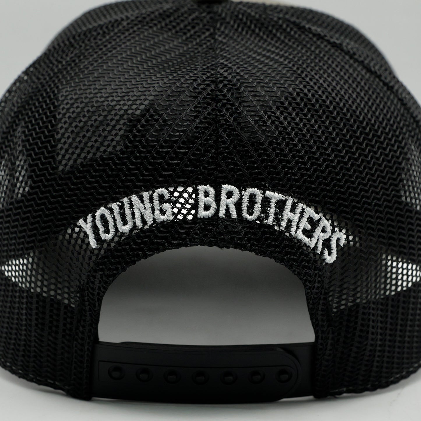Black cap with 'YOUNG BROTHERS' text on a gray background