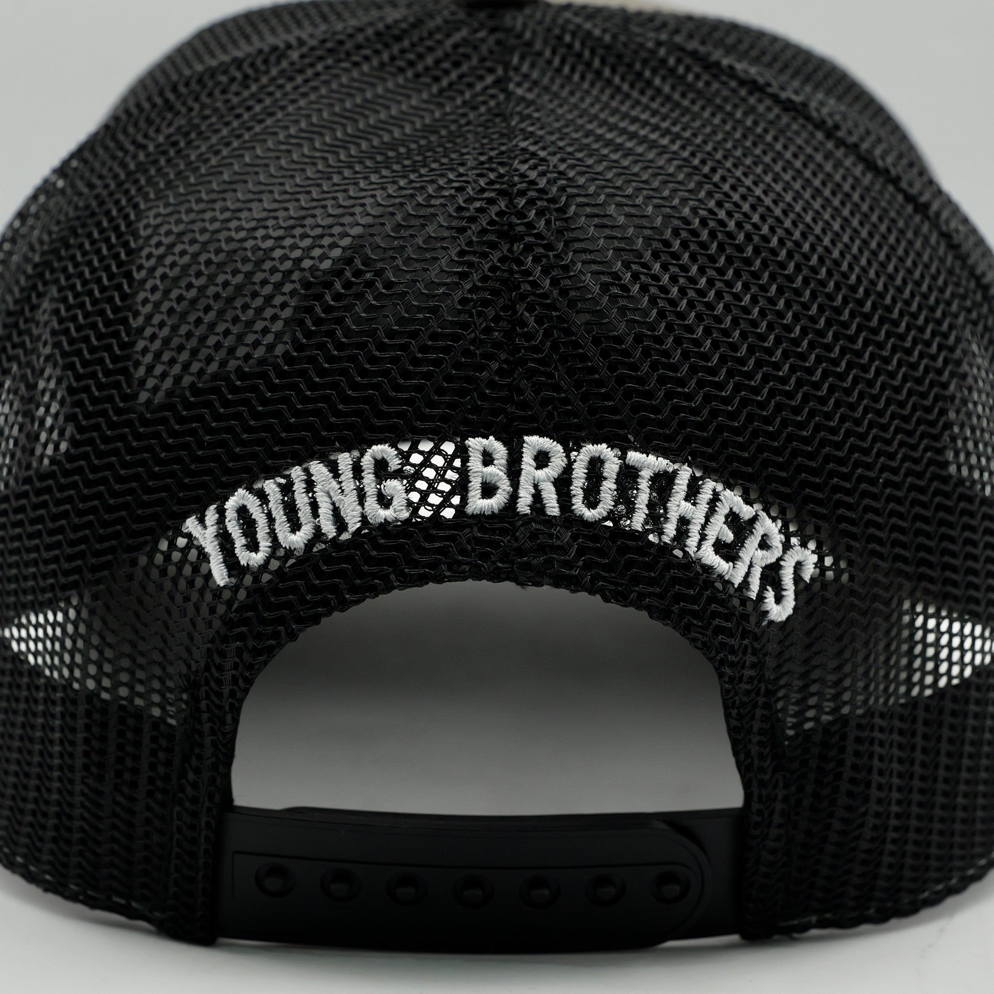 Black cap with 'YOUNG BROTHERS' text on a gray background