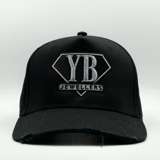 Black cap with YB Jewellers logo on a white background