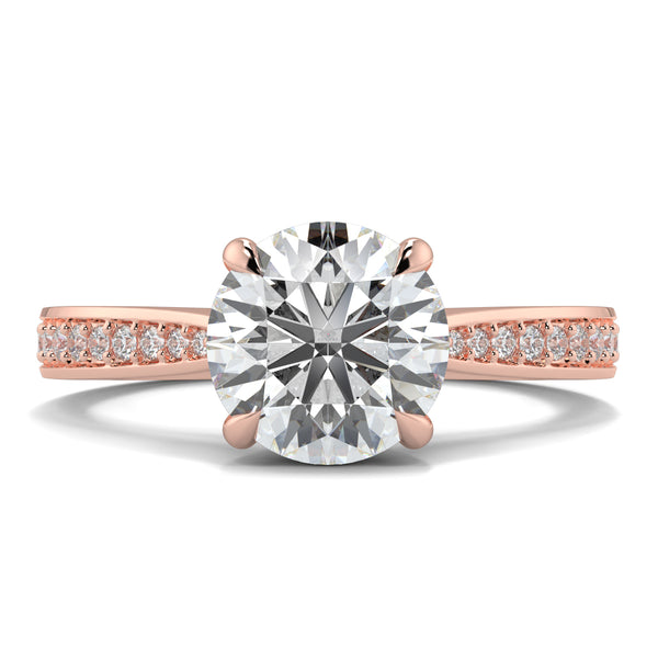 Rose gold ring with a large diamond and smaller diamonds on the band against a white background Yb jewellers engagement ring straight band