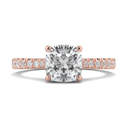 Rose gold ring with a large diamond and smaller diamonds on the band against a white background Yb jewellers engagement ring straight band