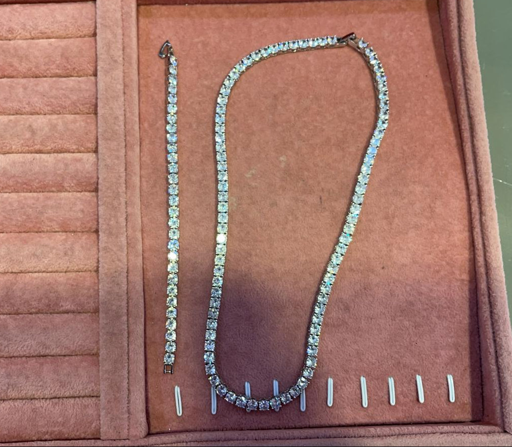 diamond tennis bracelet and necklace matching set on pink background