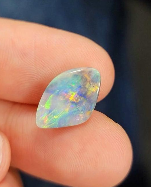 fire opal loose on blue background 