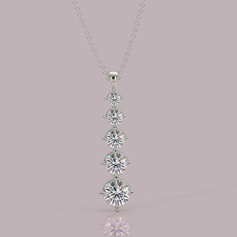 Close‑up: Aurora pendant showing 4‑claw setting and graduated round brilliant diamonds