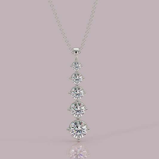 Close‑up: Aurora pendant showing 4‑claw setting and graduated round brilliant diamonds