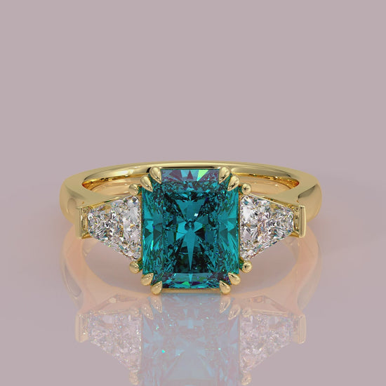 Introducing daisy radient square blue lab grown diamond engagement ring set in yellow gold with lab grown side diamonds 18k yellow gold coloured diamond ring 