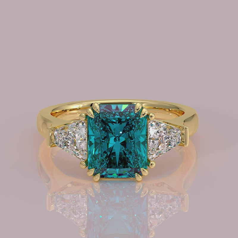 Introducing daisy radient square blue lab grown diamond engagement ring set in yellow gold with lab grown side diamonds 18k yellow gold coloured diamond ring 