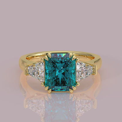 Introducing daisy radient square blue lab grown diamond engagement ring set in yellow gold with lab grown side diamonds 18k yellow gold coloured diamond ring 