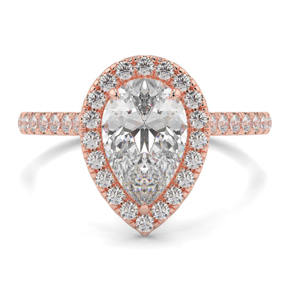 Rose gold ring with a pear-shaped diamond and smaller diamonds on a white background yb jewellers Pear engagement ring 